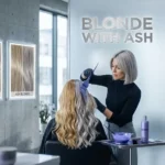 Professional hair colorist applying purple toner to correct brassy tones and achieve a cool blonde with ash look, displaying a clear comparison between warm yellow and cool ash blonde hair.
